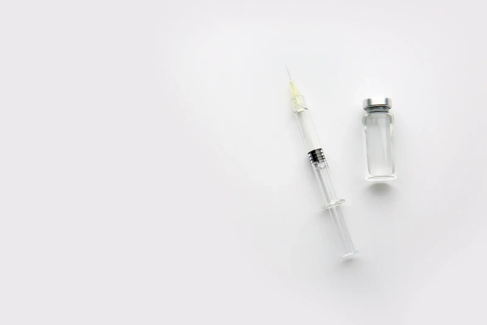 A cosmetic injectable syringe beside a glass vial, representing the Botox, Dysport, Jeuveau and Letybo wrinkle relaxers offered in Thonotosassa, FL.